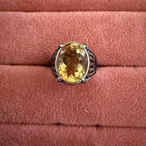 Elegant Silver and Yellow Gemstone Ring